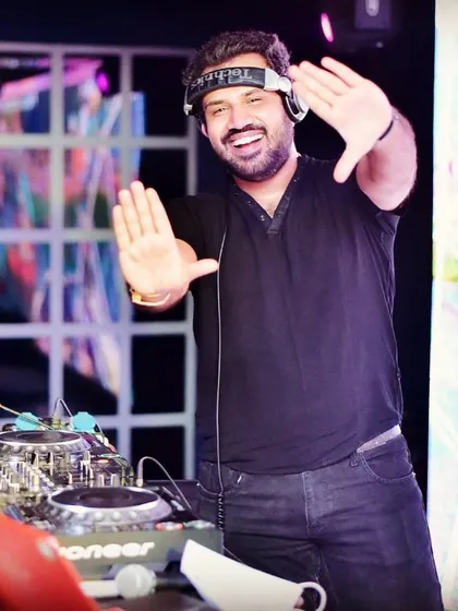 A fun, relaxed moment behind the console. It's all about good music and good vibes.