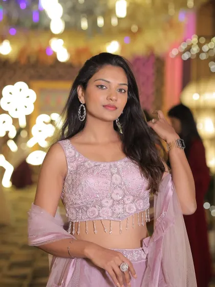 A close-up of the client in the lavender lehenga, highlighting the intricate beadwork on the blouse.
