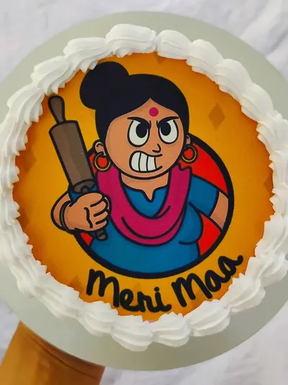 A funny "Meri Maa" cake with an edible print of an angry mom with a rolling pin. A humorous tribute that many Indian kids can relate to.