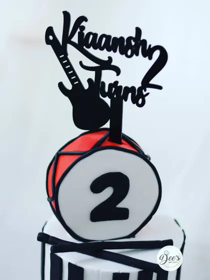 The drum and guitar topper adds a rock-and-roll vibe to this fun cake.