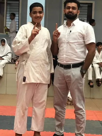 Posing with another one of our dedicated students who made it to the district level. We believe in building a strong brotherhood of disciplined martial artists.