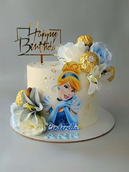 A Cinderella cake for a little princess. This chocolate nutella cake is decorated with an edible print of Cinderella, Ferrero Rocher chocolates, and beautiful flowers.