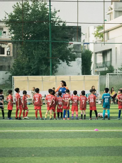 Our youngest batch of future stars lines up for instructions. We nurture talent from a very young age, building a strong foundation for their football journey.