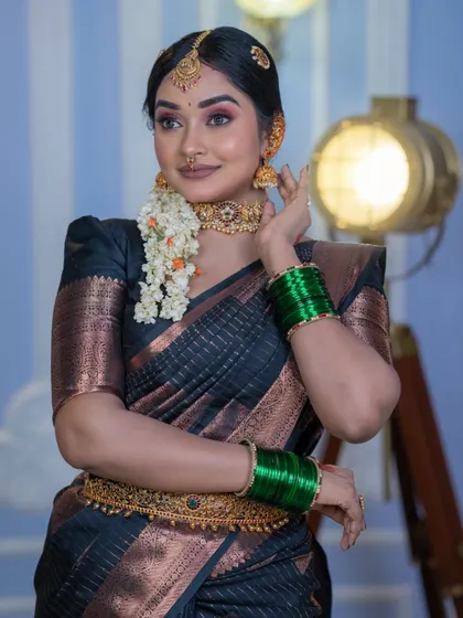 A three-quarter view that highlights the contour and the traditional jewellery.