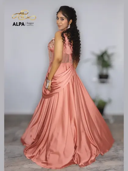 The back view of the peach gown, showing how the hairstyle and overall look come together.
