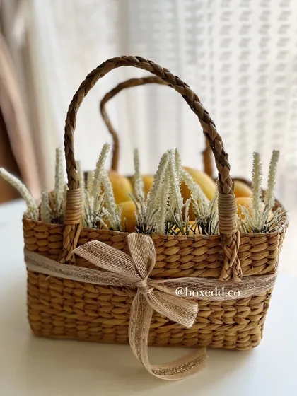 Another view of our popular mango hamper. The natural woven basket and simple ribbon make it a charming and delightful gift for any occasion, especially summer weddings.