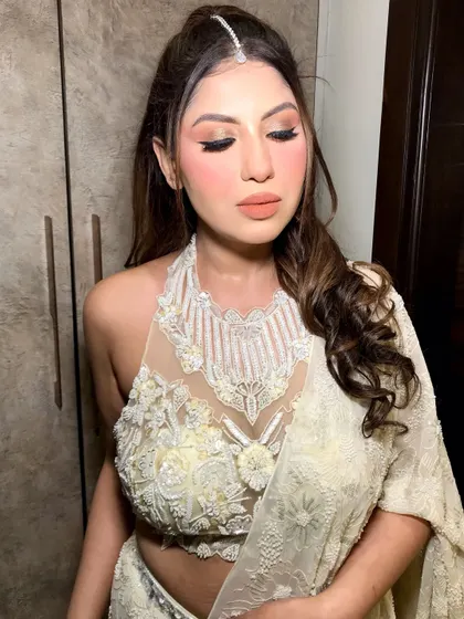 A close-up of her makeup, with the maang tikka adding a traditional touch to the modern styling.