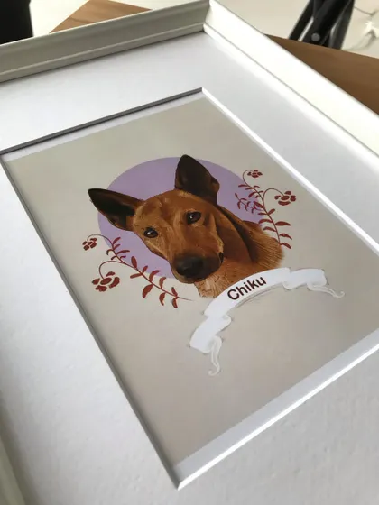 This angle of the framed Chiku portrait shows the depth created by the mat board, which separates the art from the glass for a professional gallery look.