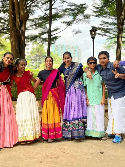 Fashion fades, but tradition sails through centuries. Our older students look stunning in their traditional wear, ready for a group performance.