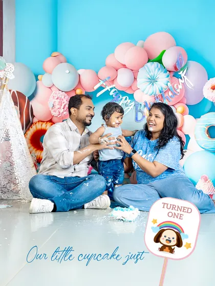 A first birthday is a celebration for the whole family. I love capturing these moments where mom and dad join in on the cake smash fun, creating a memory filled with love and laughter.