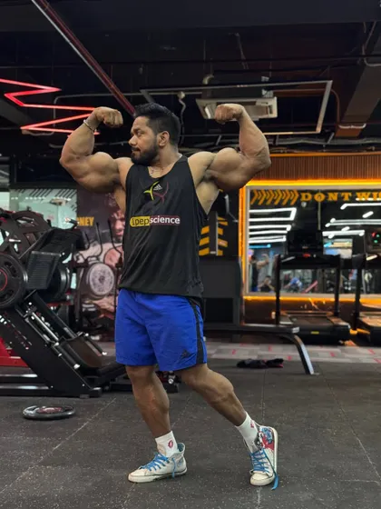 A front double bicep pose. If you want peace, prepare for war.