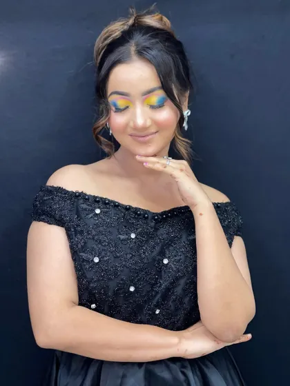 Another pose showcasing the artistic, painted style of this multi-colored eye makeup.