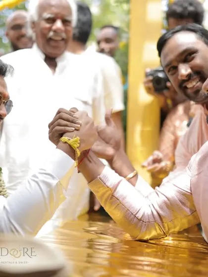 The groom and his brother-in-law in a friendly arm-wrestling match. We help plan these ice-breakers that bring both families together in laughter.