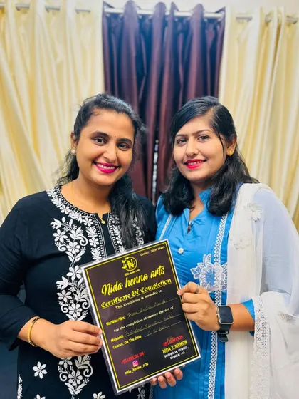 Celebrating another student's achievement. Her hard work and passion for mehandi have truly paid off.