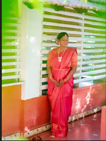 The complete look, from the makeup and hair to the perfectly draped saree. Every element works together to create a timeless South Indian bridal aesthetic.