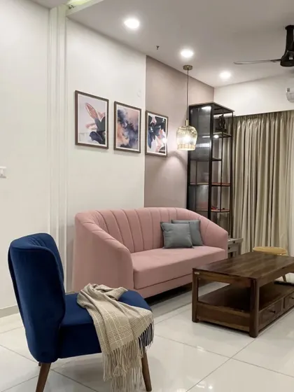 Another view of the living room with the pink and blue color combination.