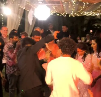 The dance floor is a whirlwind of motion and celebration.