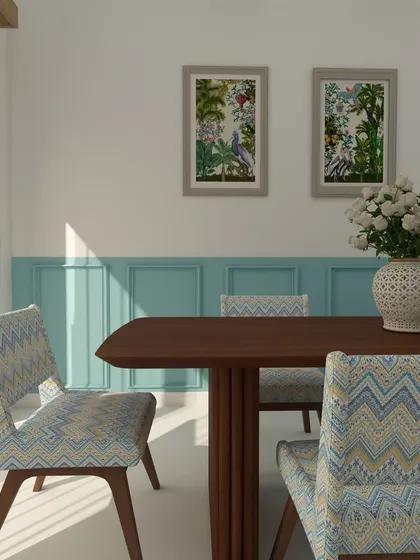 This dining space uses a beautiful shade of blue on the lower half of the wall, creating a modern take on wainscoting. The patterned chairs and dark wood table complete this inviting setup.