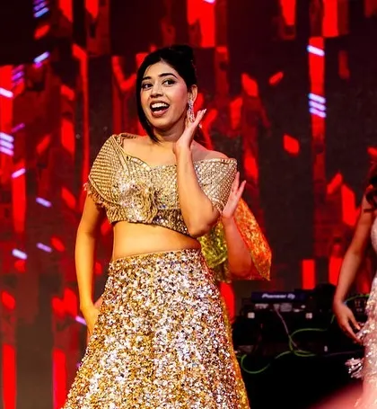 Two bridesmaids in perfect sync, enjoying their performance.