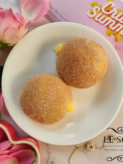 My Vanilla Cinnamon Doughnut is a simple pleasure. It's filled with a creamy homemade vanilla custard and coated in a light dusting of cinnamon sugar.