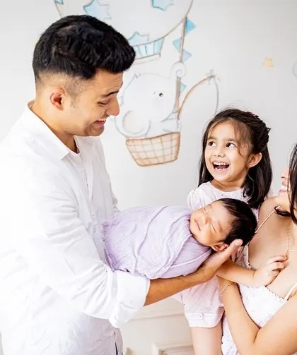 A beautiful family of four celebrating their newest member. I love capturing these moments against the backdrop of your baby's own nursery.
