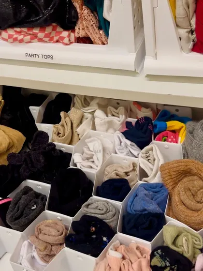 Drawer organizers are a game-changer for smaller items. Here, we used honeycomb dividers to give every pair of socks and every scarf its own neat little compartment.