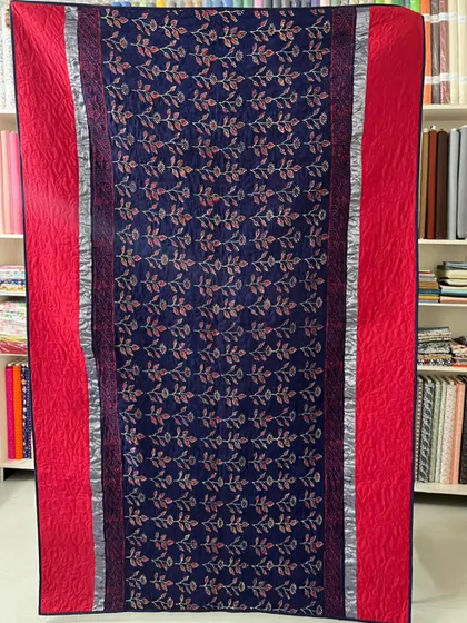 The reverse side of the navy and red saree quilt, offering a more subdued but equally elegant look.