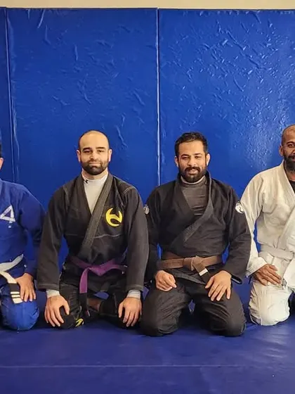 A group of our senior students and coaches after an open mat session. This is the core of our team, dedicated to consistent training and long-term improvement.