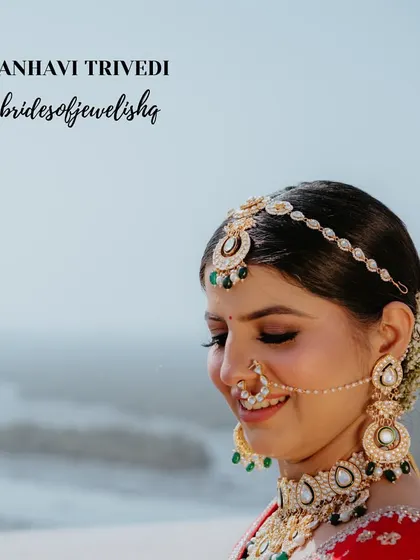 A close-up of our bride Janhavi's final wedding look. She chose an elaborate polki choker with emerald drops, paired with a matching sheeshphool and nath for a truly royal aesthetic.