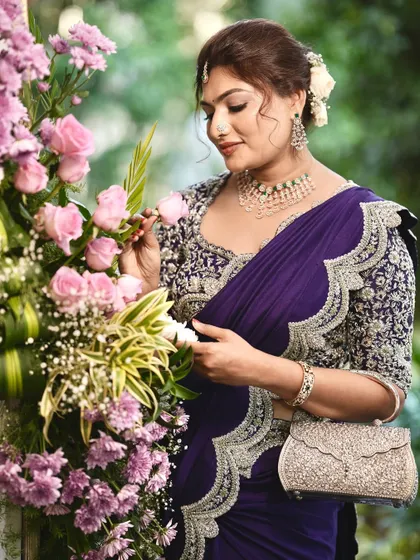 A beautiful shot of the bride with flowers, highlighting the soft and romantic feel of her look.