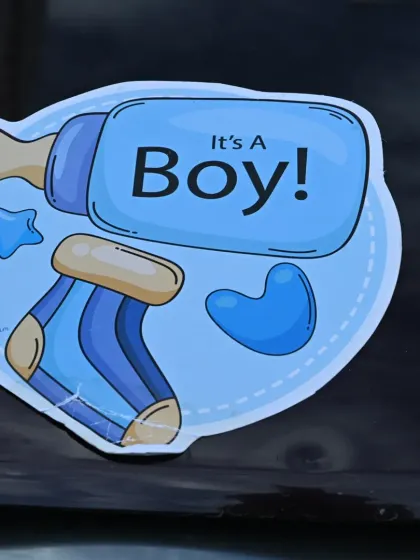 It's all in the details. A custom "It's a Boy!" sticker adds a personal touch to the car decoration, announcing the happy news to the world as the family drives their newborn home.