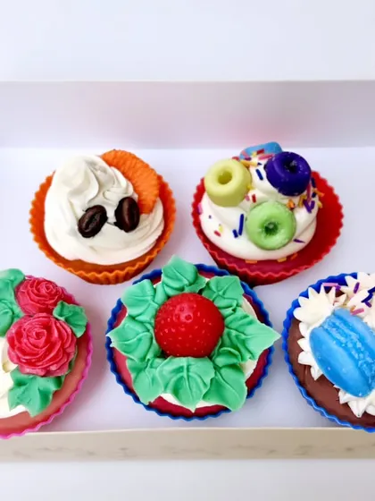 A box of assorted cupcake soaps, showcasing the variety of designs from my online workshop.