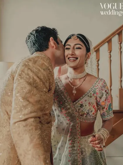 A sweet kiss and a genuine smile, this candid shot from Pragya and Adil's wedding was highlighted in their Vogue Weddings feature.