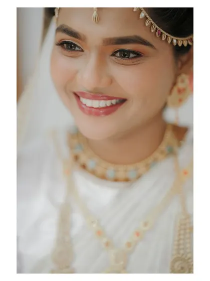 A beautiful, soft-focus portrait of the bride, her happy and gentle expression captured perfectly.