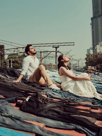 A unique pre-wedding shot of a couple relaxing on the rooftops of Dhobi Ghat. This image showcases our creative approach to capturing the unseen sides of Mumbai.