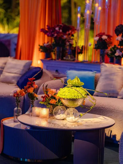 Another view of the modern lounge area, showing how the floral arrangements and decor elements work together to create a stylish and comfortable space for guests.