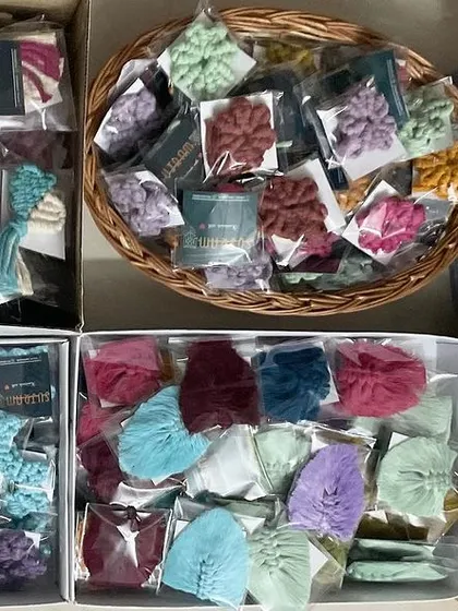 So many keychains! This shows several boxes filled with different designs, all ready for a big event. I can definitely handle bulk orders.
