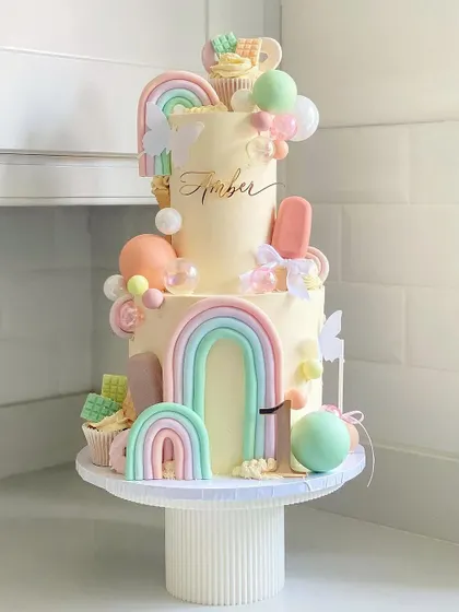 A full view of the amazing "Sweet One" first birthday cake, a true candy land creation.