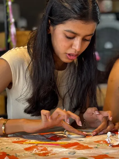 The concentration on her face says it all. Our workshops are a place to get lost in the creative process.