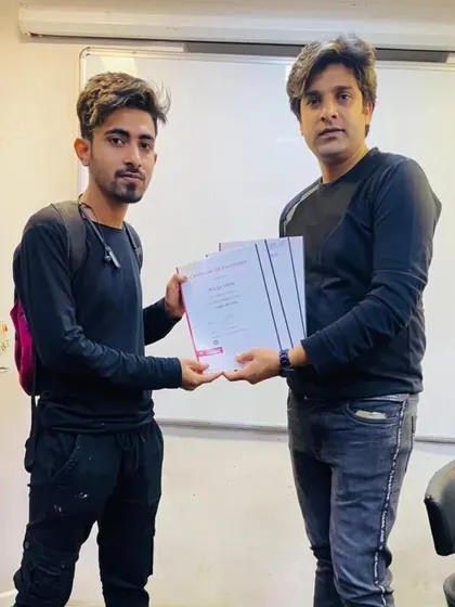 Handing over the certificate is the best part of my job. It marks the moment a student officially becomes a professional, ready for the industry.