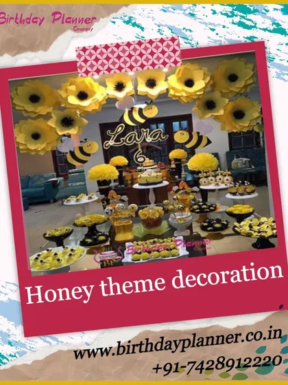 A sweet-as-can-be Honey Bee theme for Lara's party. The decor is buzzing with yellow and black, featuring paper sunflowers, bee cutouts, and a dessert spread with honey-inspired treats.