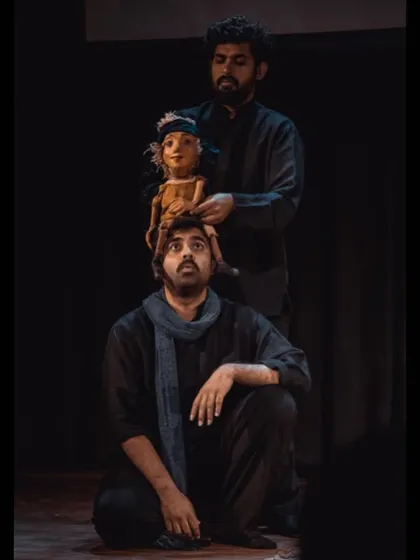 A creative pose with a puppet on an actor's head, showing the fun we have backstage and on stage. Our puppetry is a key element of the show's unique charm.