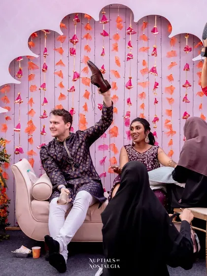 The shoe game in full swing at a cross-cultural Mehendi, bringing laughter and fun as guests from different backgrounds enjoy the tradition together.