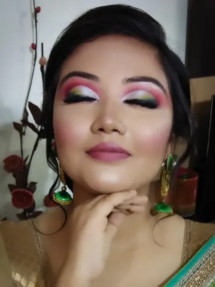 This shot shows the full artistry of the colorful eyeshadow, a perfect look for a themed party or festival.