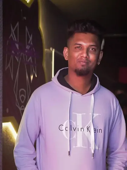 A portrait in a Calvin Klein hoodie. This shows my modern, brand-conscious style that complements my DJ persona.