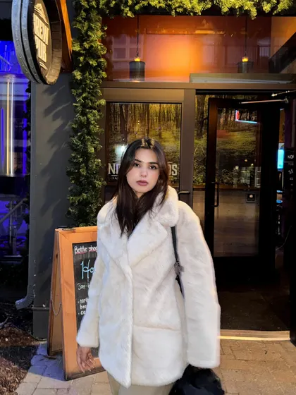 Posing outside a pub in Blue Mountain, enjoying the evening ambiance.