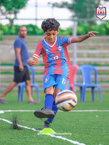 A player practices their striking technique, kicking up turf in the process.