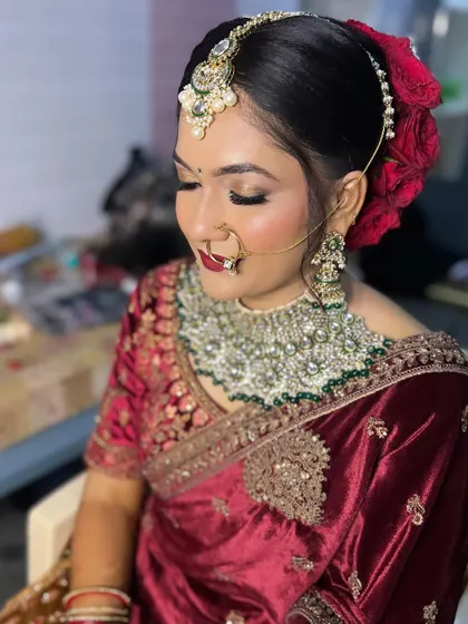 Another angle showing the beautiful floral bun and the intricate details of her jewelry.