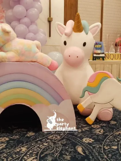 A close-up of the adorable unicorn and rainbow props. These custom-made pieces are perfect for photos and add a playful, three-dimensional element to the decor.