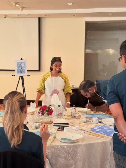 An instructor offers guidance at The White Box workshop, ensuring everyone feels supported.